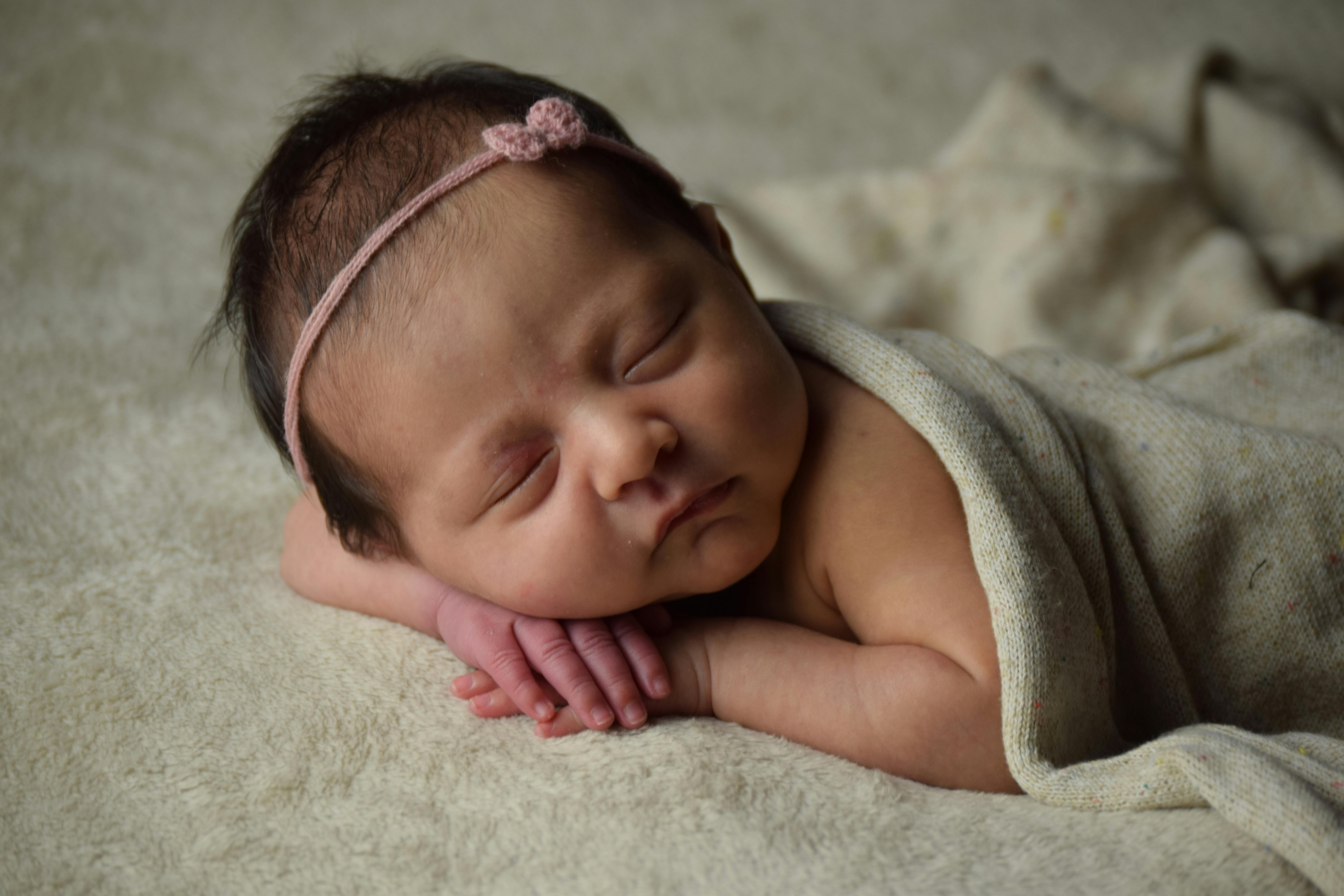 Adorable newborn baby photoshoot with props